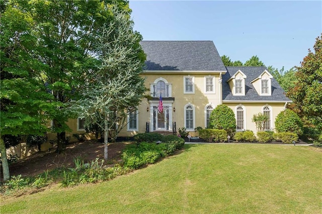 colonial home with a front yard