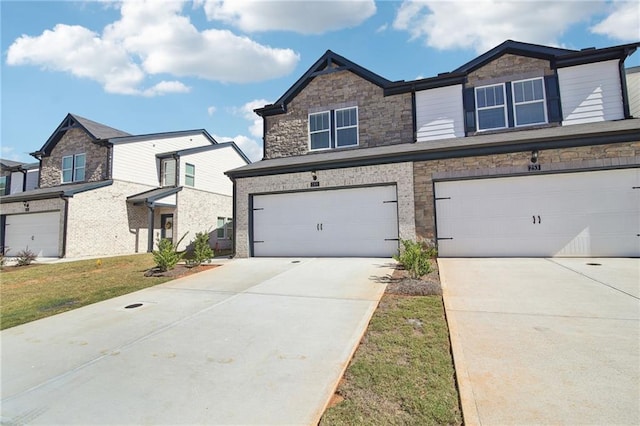 view of front of house with a garage and a front yard