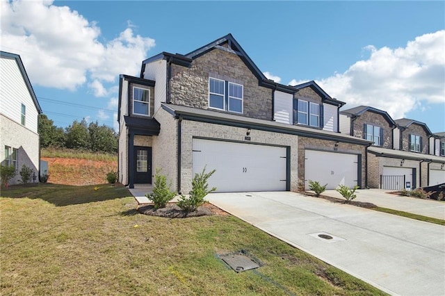 multi unit property featuring a garage and a front yard