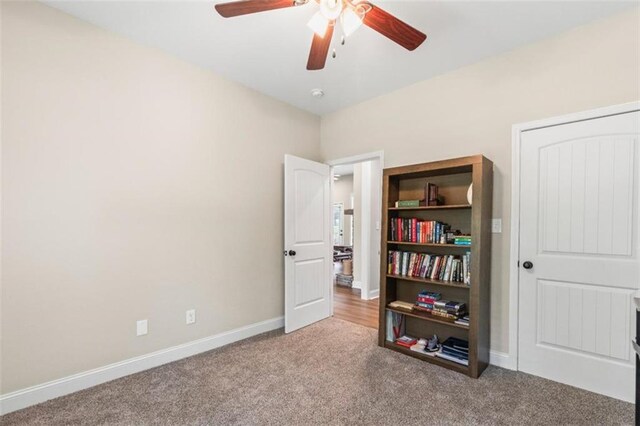 bedroom with baseboards, ceiling fan, and carpet