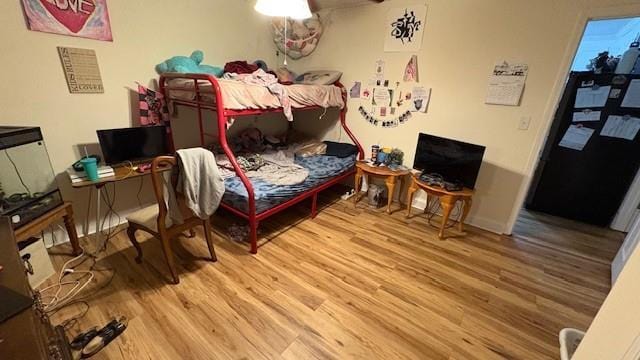 bedroom featuring wood finished floors