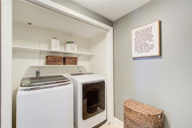 laundry area with laundry area and washing machine and clothes dryer