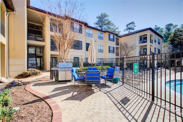 view of patio featuring fence