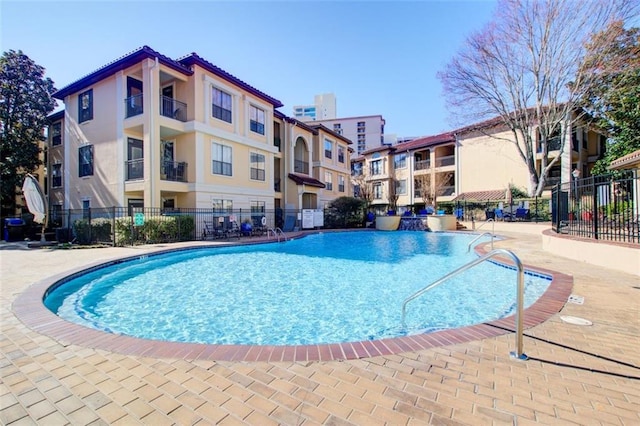 community pool featuring fence