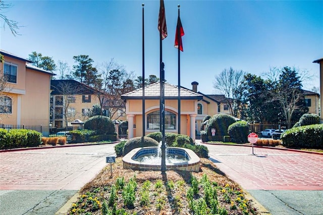 view of community featuring fence