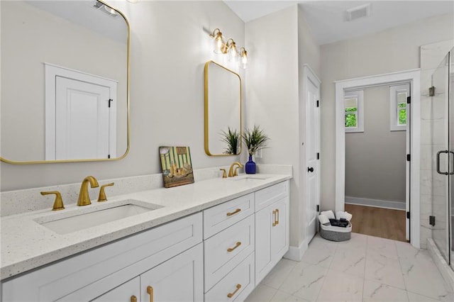 1698 Cunningham Rd SW, Marietta, GA 30008 - full bath featuring double vanity, marble finish flooring, a stall shower, and baseboards