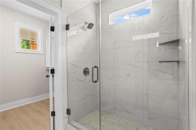 1698 Cunningham Rd SW, Marietta, GA 30008 - full bath with a marble finish shower, baseboards, and wood finished floors