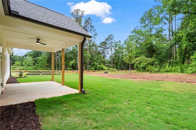 1698 Cunningham Rd SW, Marietta, GA 30008 - view of green lawn featuring a ceiling fan and a patio area