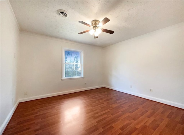 empty room featuring ceiling fan, dark hardwood / wood-style floors, and a textured ceiling