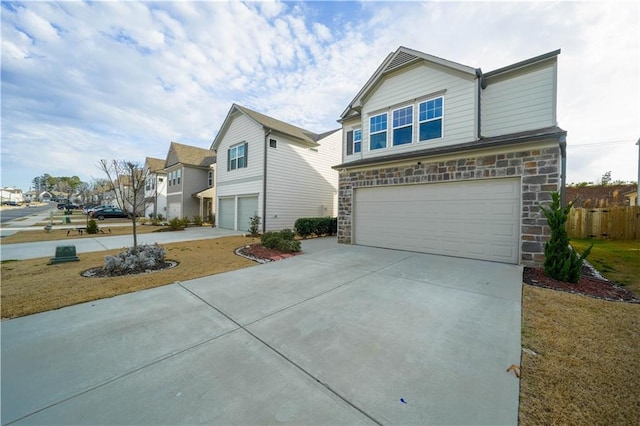 view of front facade with a front yard and a garage