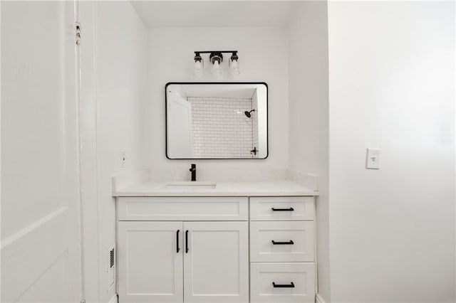 bathroom featuring vanity and walk in shower