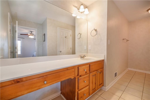 bathroom featuring tile patterned flooring, visible vents, vanity, and baseboards