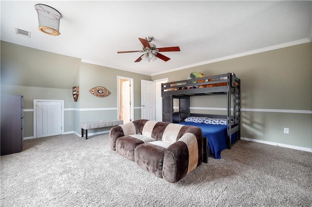 carpeted bedroom with a ceiling fan, baseboards, visible vents, and crown molding