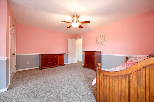 unfurnished bedroom featuring carpet, ceiling fan, and baseboards