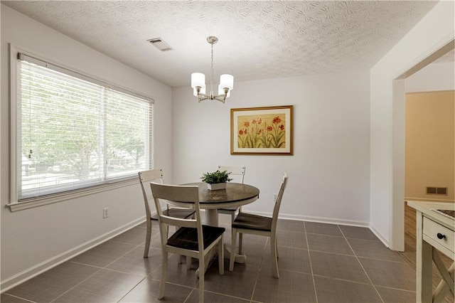 340 Monivea Ln, Roswell, GA 30075 - dining room with a chandelier, a textured ceiling, and baseboards