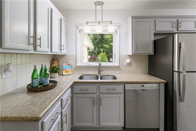 340 Monivea Ln, Roswell, GA 30075 - kitchen featuring dishwasher, a sink, freestanding refrigerator, tasteful backsplash, and gray cabinetry