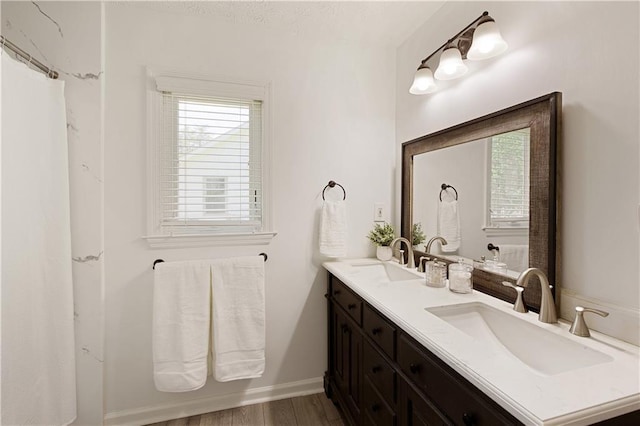 340 Monivea Ln, Roswell, GA 30075 - full bath featuring double vanity, wood finished floors, and baseboards