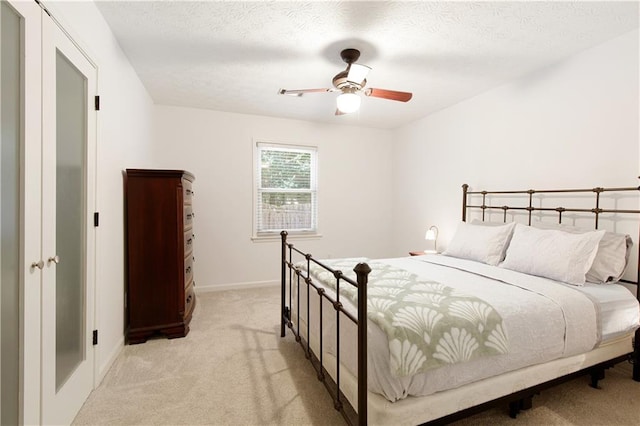 340 Monivea Ln, Roswell, GA 30075 - bedroom featuring light colored carpet, baseboards, ceiling fan, and a textured ceiling