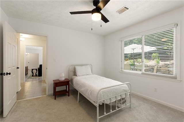 340 Monivea Ln, Roswell, GA 30075 - bedroom with light carpet, baseboards, a textured ceiling, and a ceiling fan