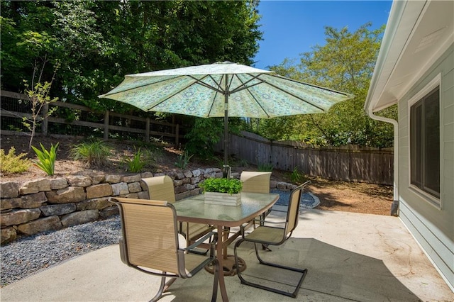 340 Monivea Ln, Roswell, GA 30075 - fenced backyard with outdoor dining space and a patio