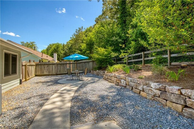 340 Monivea Ln, Roswell, GA 30075 - fenced backyard featuring a patio area