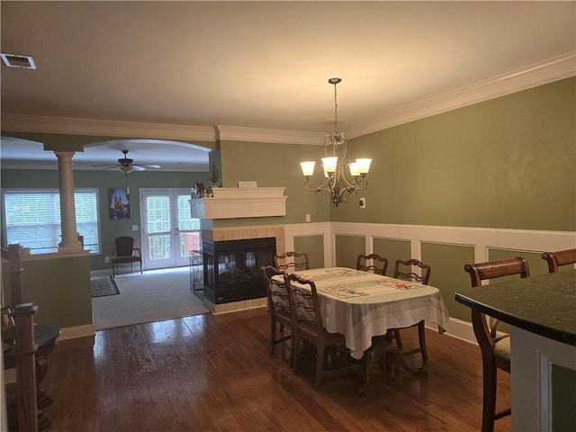 106 Trailside Way, Hiram, GA 30141 - dining room with ornamental molding, dark wood-style flooring, a fireplace, a ceiling fan, and a chandelier