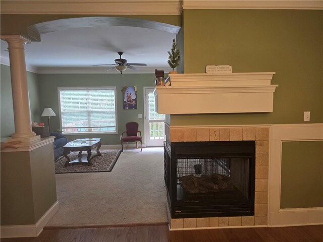 106 Trailside Way, Hiram, GA 30141 - living room featuring decorative columns, crown molding, ceiling fan, arched walkways, and a fireplace