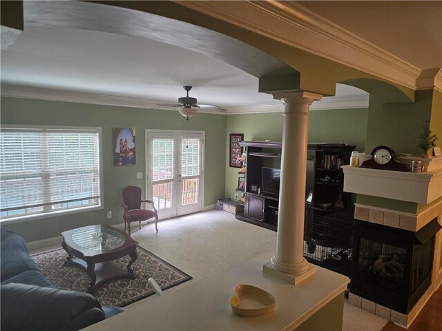106 Trailside Way, Hiram, GA 30141 - carpeted living room featuring ornate columns, arched walkways, ceiling fan, ornamental molding, and baseboards