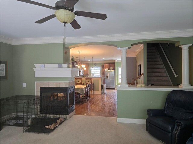 106 Trailside Way, Hiram, GA 30141 - living area featuring ornamental molding, carpet flooring, ceiling fan, decorative columns, and baseboards