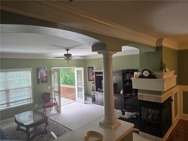 106 Trailside Way, Hiram, GA 30141 - living area featuring arched walkways, ornamental molding, ornate columns, ceiling fan, and a tile fireplace