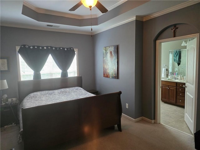 106 Trailside Way, Hiram, GA 30141 - bedroom with crown molding, light carpet, a tray ceiling, ensuite bathroom, and baseboards