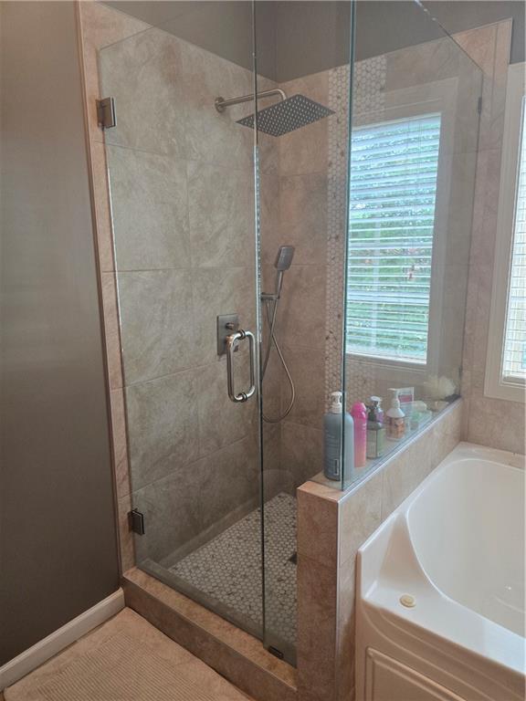 106 Trailside Way, Hiram, GA 30141 - bathroom with a bath, a shower stall, and tile patterned floors