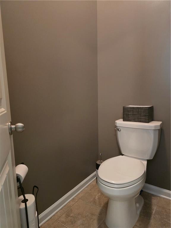 106 Trailside Way, Hiram, GA 30141 - bathroom featuring baseboards, toilet, and tile patterned floors