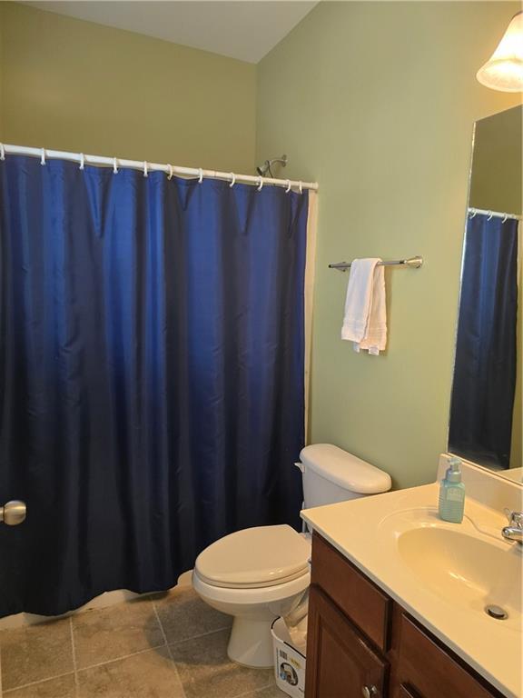 106 Trailside Way, Hiram, GA 30141 - full bathroom featuring toilet, vanity, tile patterned flooring, and a shower with curtain