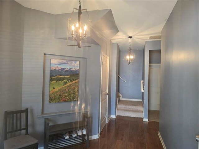 106 Trailside Way, Hiram, GA 30141 - hallway with a chandelier, dark wood-style flooring, stairs, and baseboards