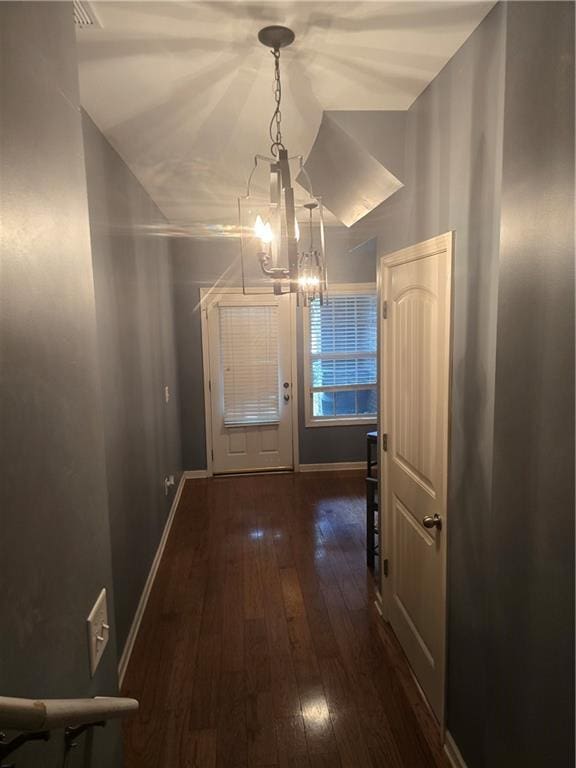 106 Trailside Way, Hiram, GA 30141 - hallway with a chandelier, wood-type flooring, and baseboards