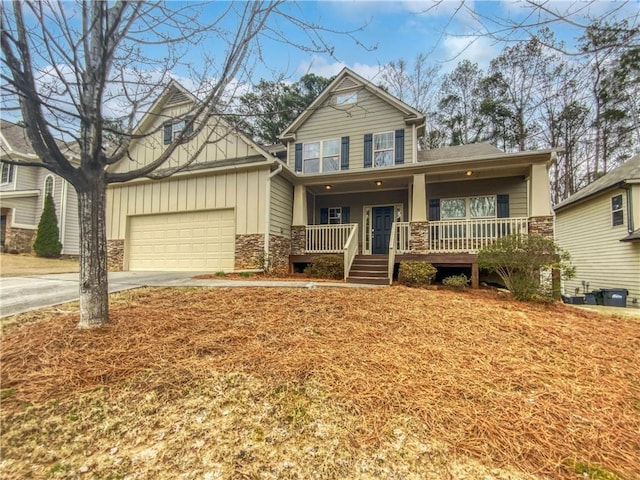 craftsman-style home with a garage and a porch