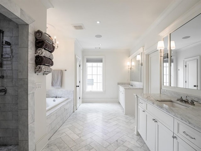 bathroom with ornamental molding, visible vents, and a sink