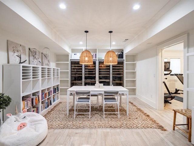 dining area with recessed lighting, visible vents, and wood finished floors