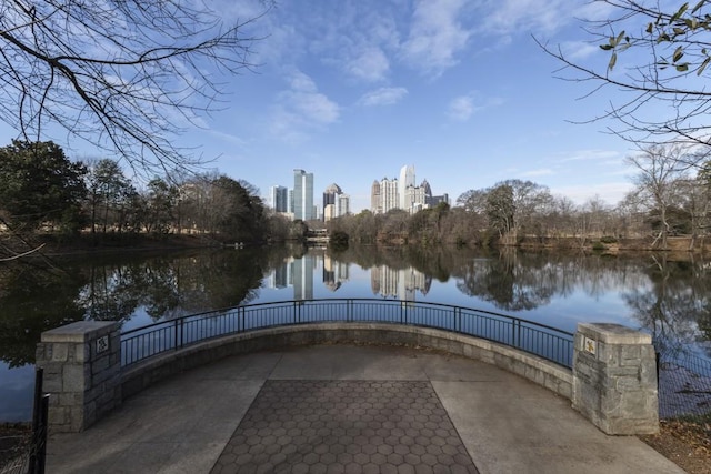 view of property's community with a view of city and a water view