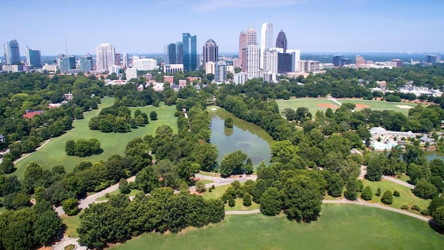 drone / aerial view featuring a water view and a city view