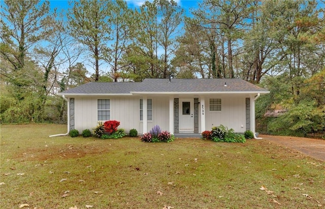 ranch-style home with a front lawn