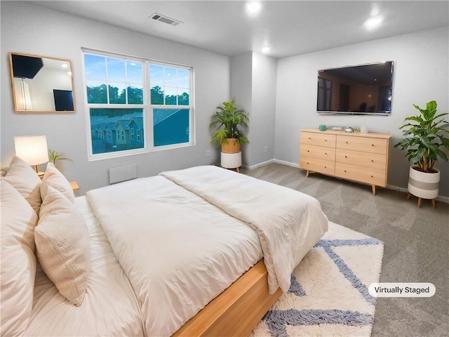 bedroom with baseboards, visible vents, dark colored carpet, and recessed lighting