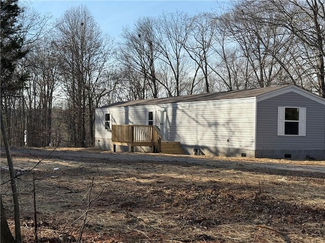 exterior space featuring a wooden deck