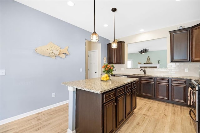 dining area with baseboards, light wood-style flooring, a chandelier, and visible vents