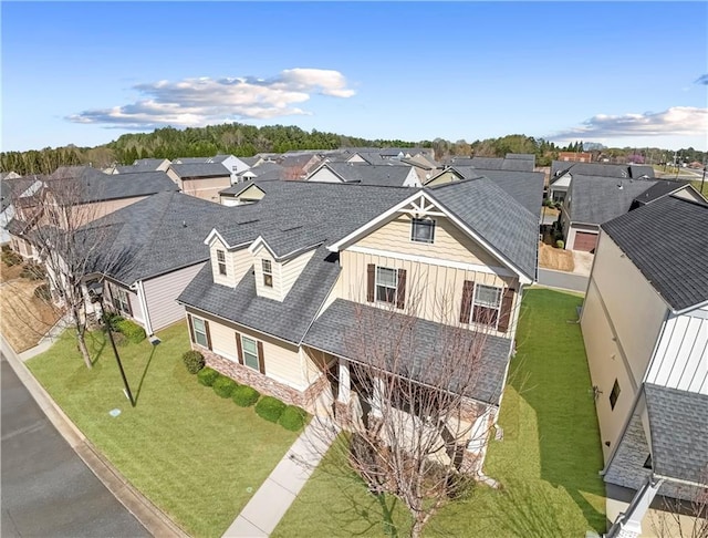 view of front of property with an attached garage, driveway, and a front yard