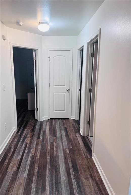 hall with dark hardwood / wood-style floors