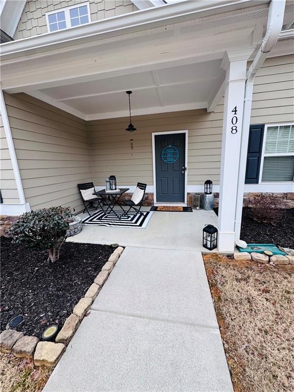 doorway to property with a patio