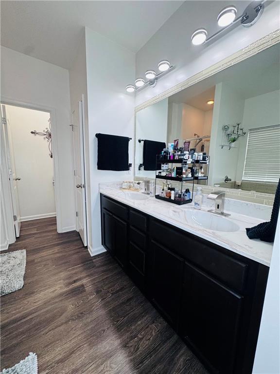 bathroom featuring vanity and wood-type flooring