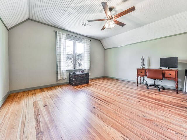 unfurnished office featuring light hardwood / wood-style flooring, vaulted ceiling, and ceiling fan